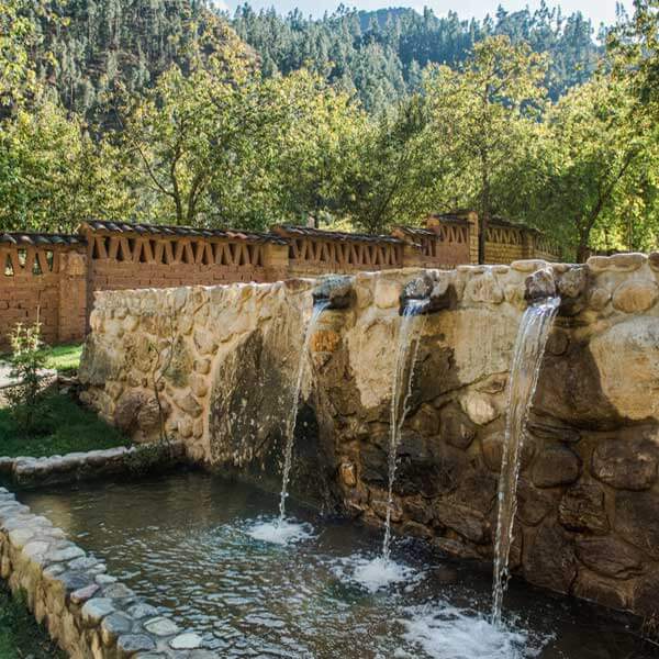 A serene water fountain. Explore this Peru yoga retreat with The Travel Yogi