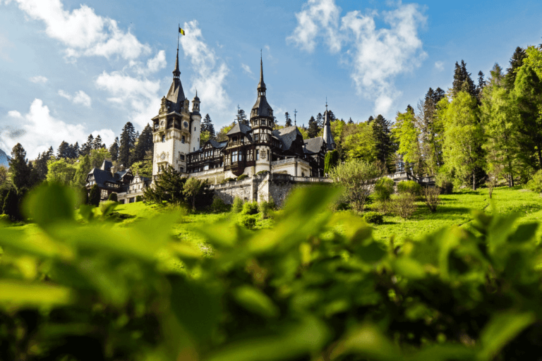 White castle amid a lush forest. Here are 10 bucket list travel destinations with The Travel Yogi. Photo credit: Majkl Velner