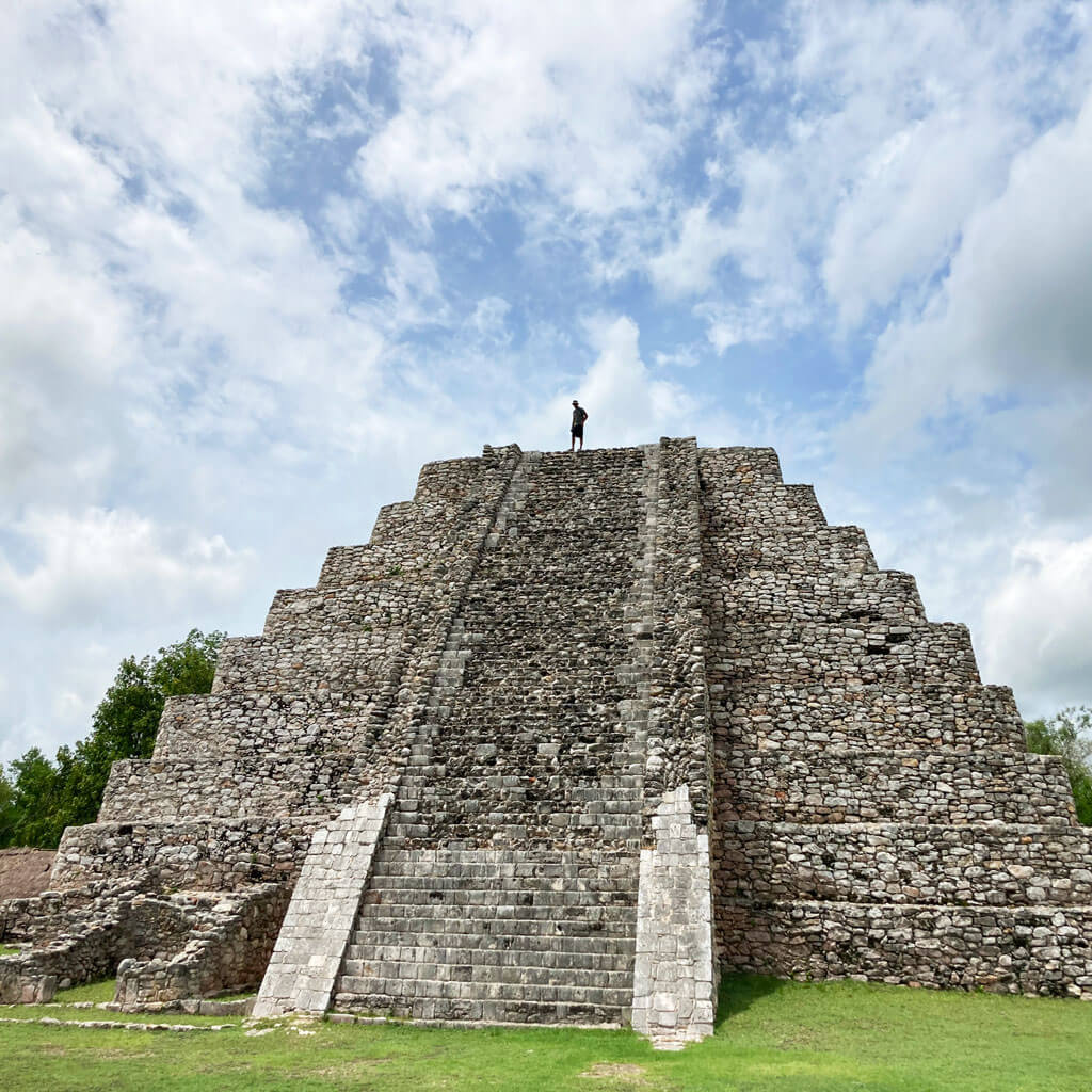 Man walks atop Mayan ruins Explore Mérida on this yoga retreat in Mexico with The Travel Yogi.