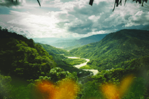 A verdant valley and river in La Merced, Peru. Experience a despacho ceremony with The Travel Yogi. Photo by Hans Luiggi.