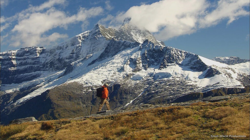 Person hiking near Mount Aspiring and Lake Wanaka in New Zealand