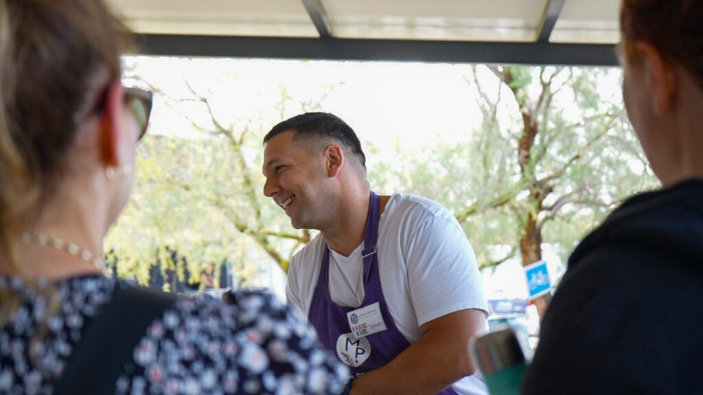 Sylvain from Un Mas en Provence smiling while giving a presentation about Essential Oils.